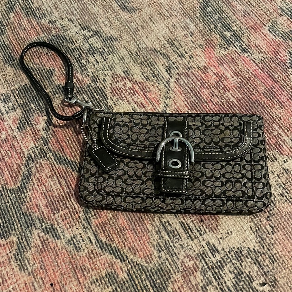 Black and grey Coach wristlet